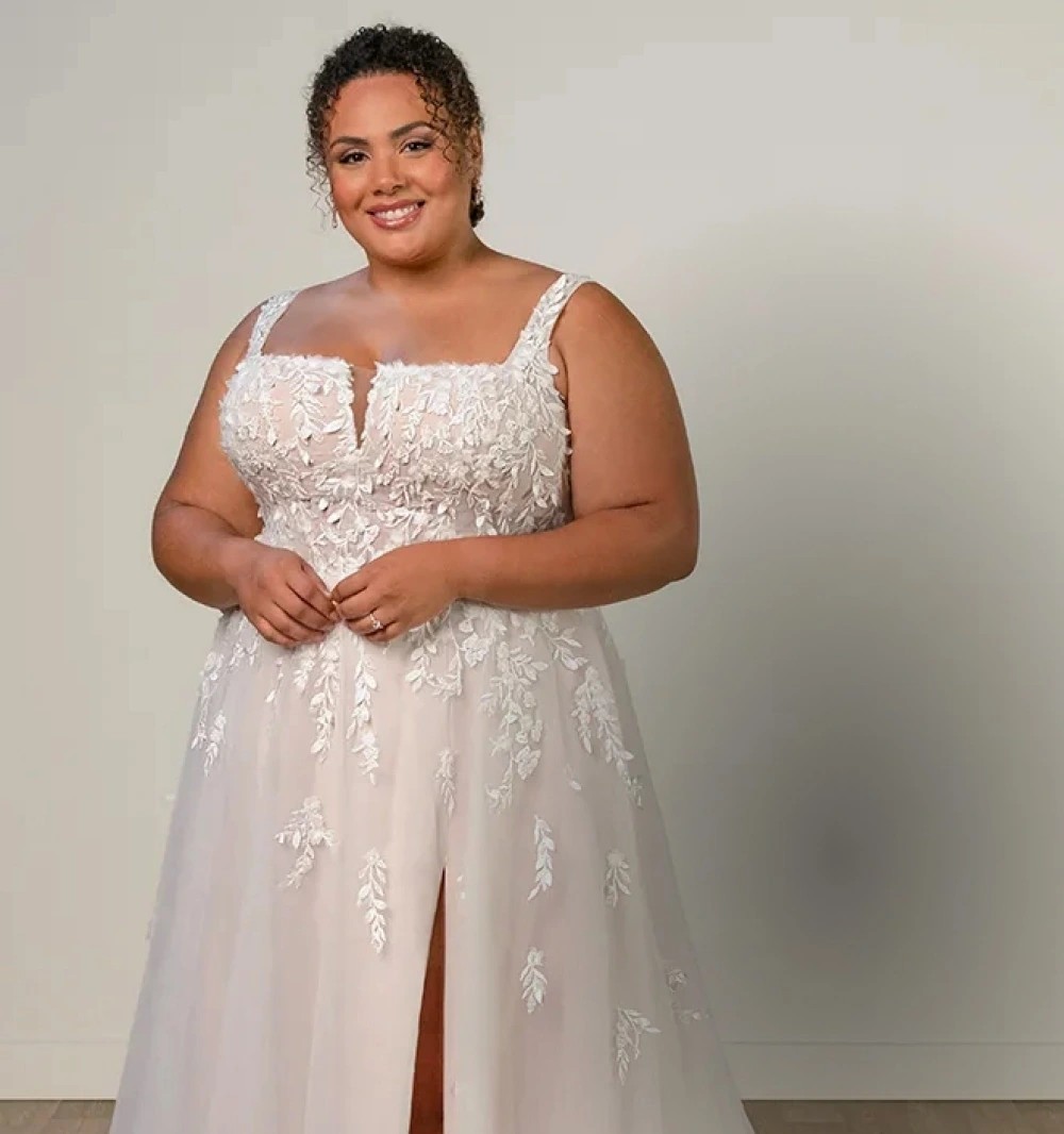 Model wearing a Downtown Gowns Plus Size Collection Gown